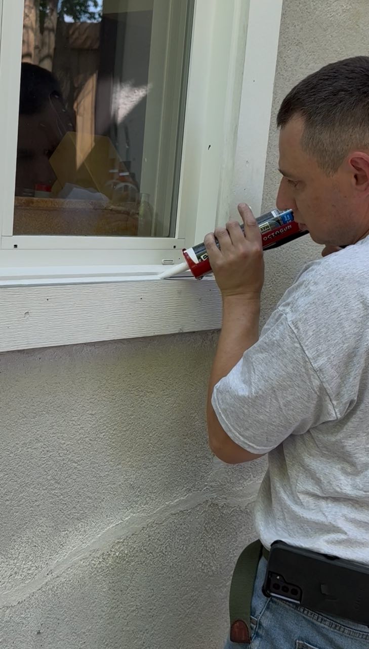Sealing and caulking an exterior window frame as prep work ahead of an exterior paint job